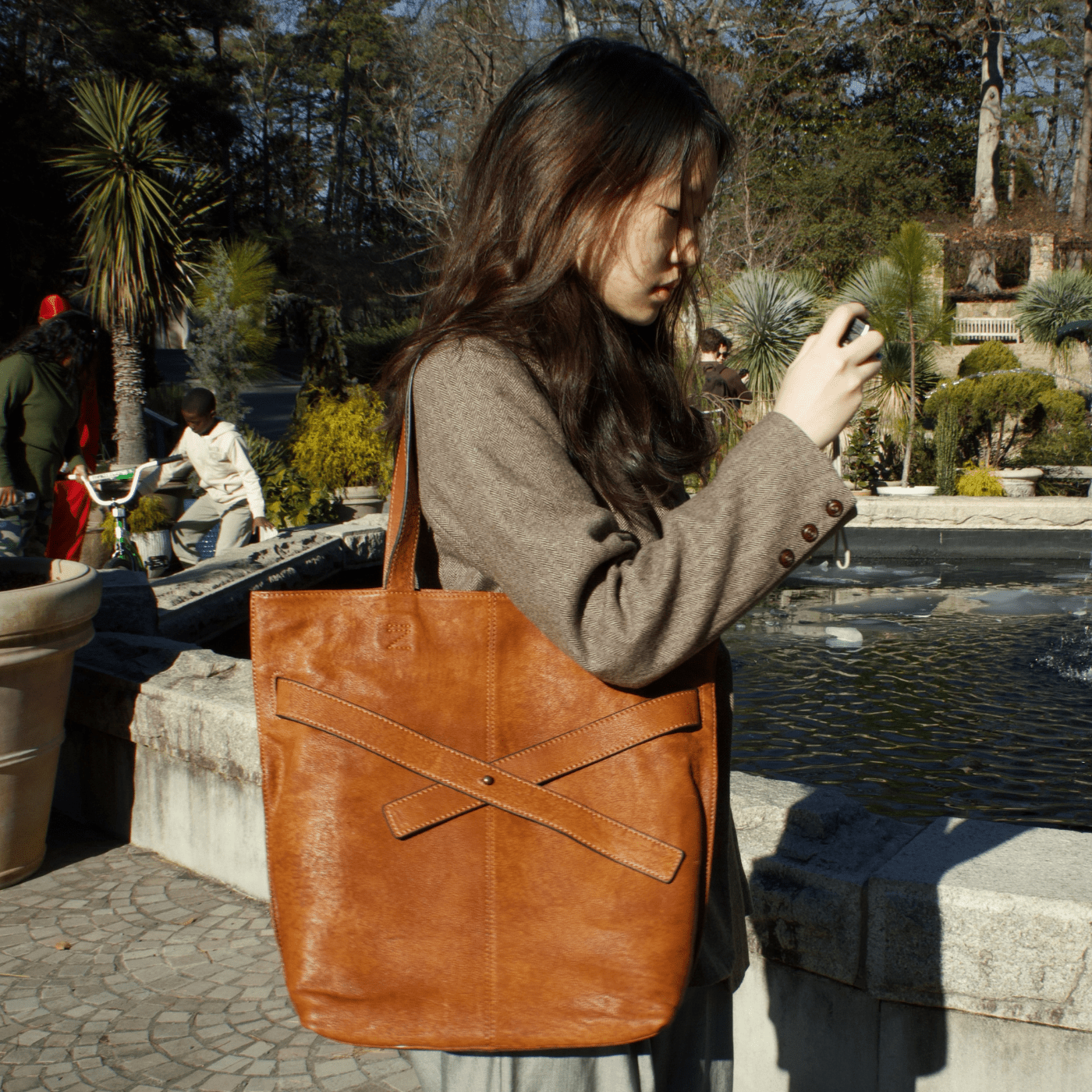 Soft Leather Tote with Unique Cross - Strap Design - Golden Crow